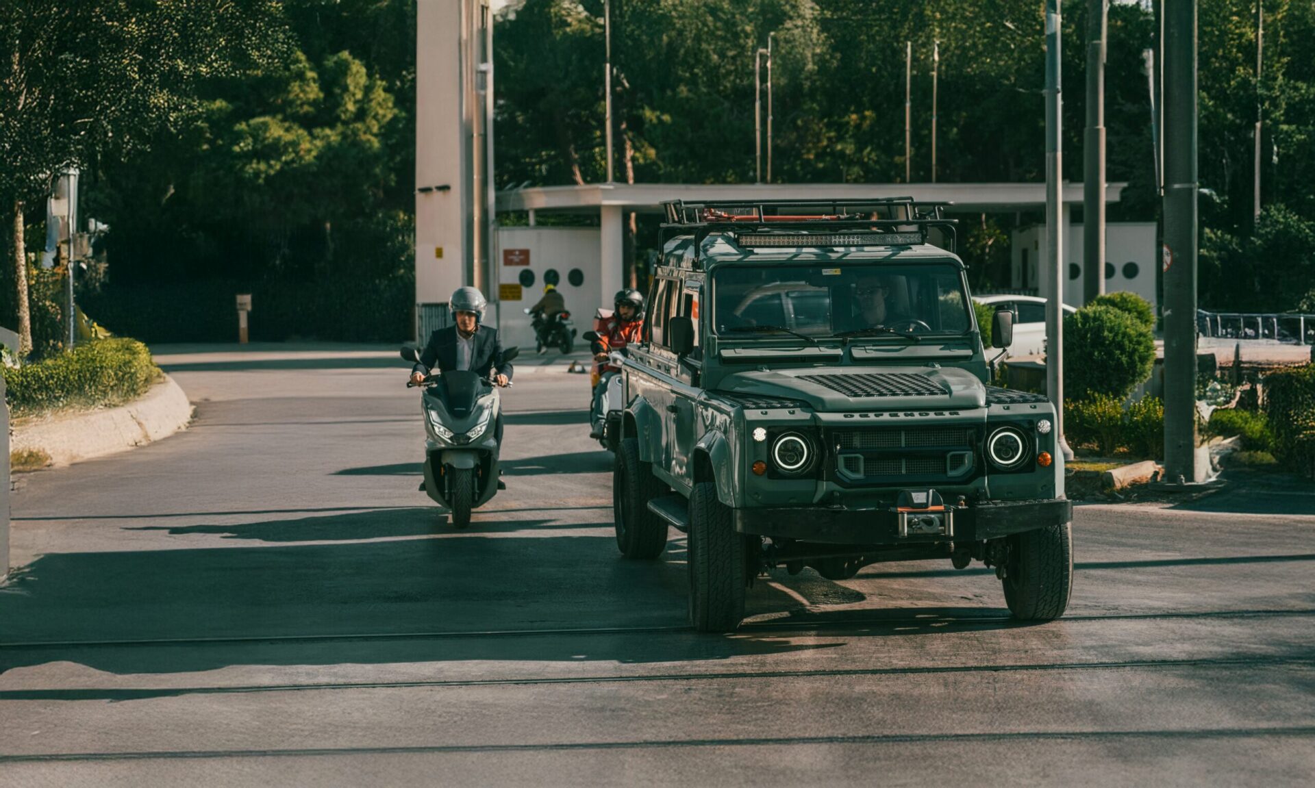 Pastel Blue land rover defender 110 in city streets