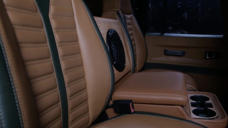 british-racing-green-land-rover-defender-110-backseat