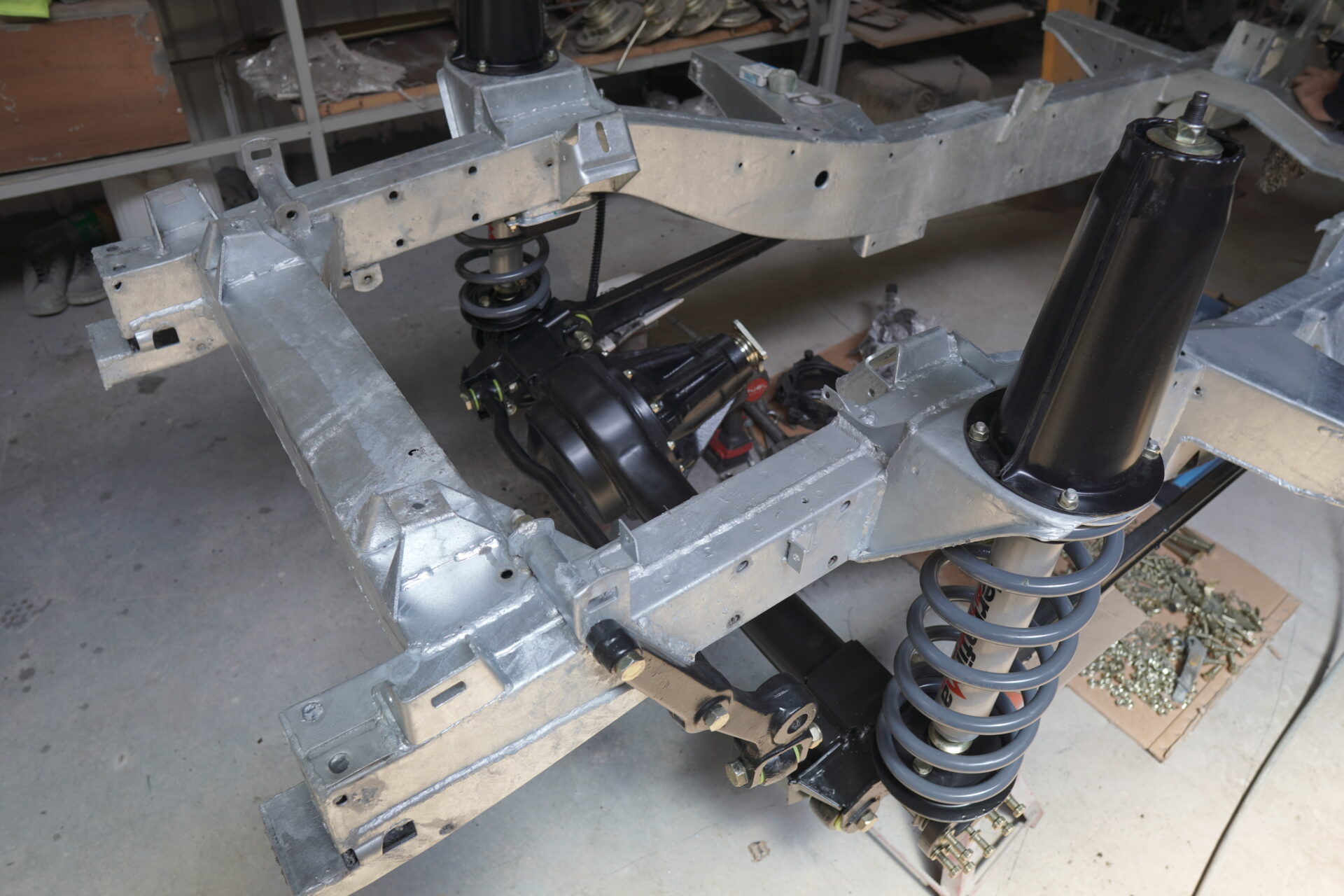 Galvanized Chassis having drivetrain components installed - Suspension, and differentials