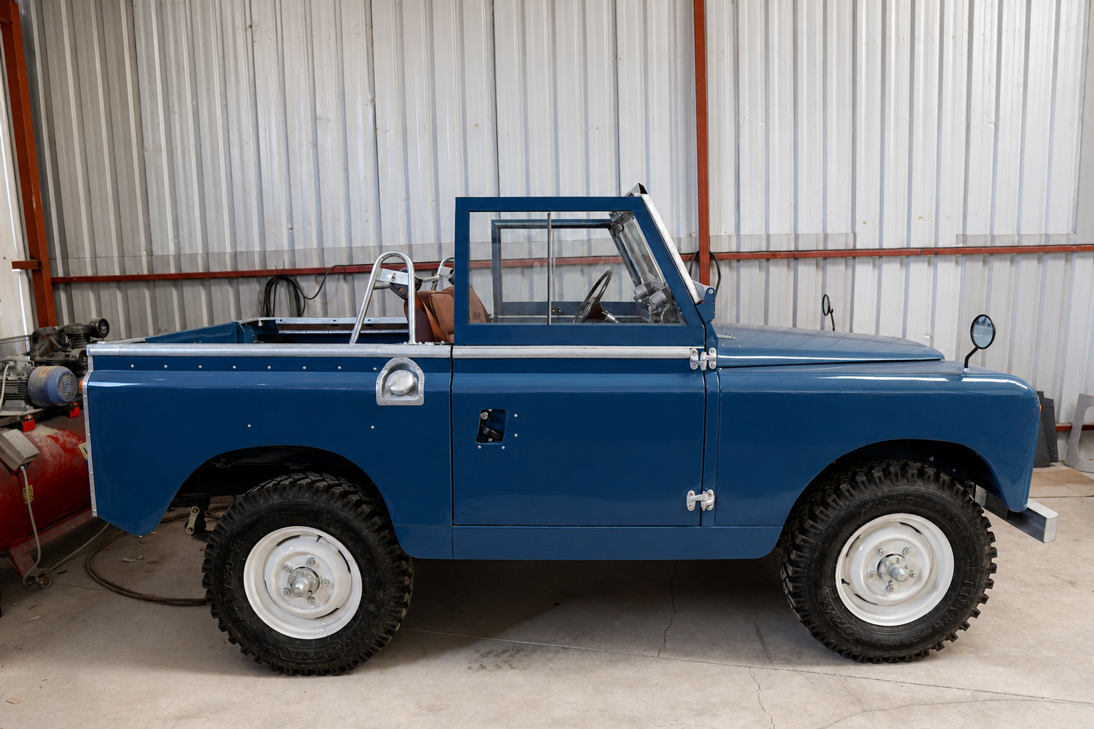 Land Rover Series 2 in Petrol Blue - Sideways angle in workshop